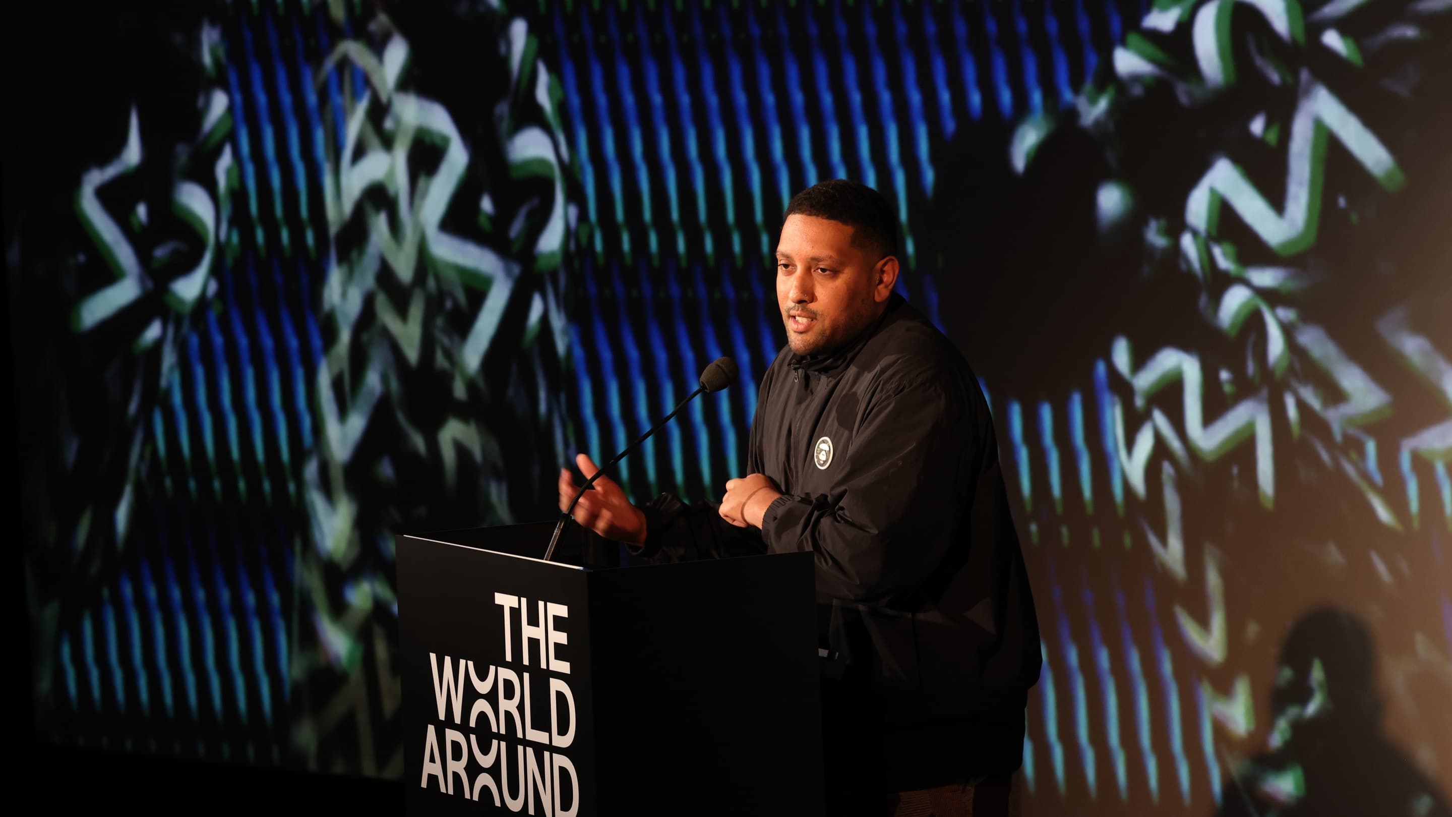 Joseph Zeal-Henry speaking at The World Around Summit 2023.