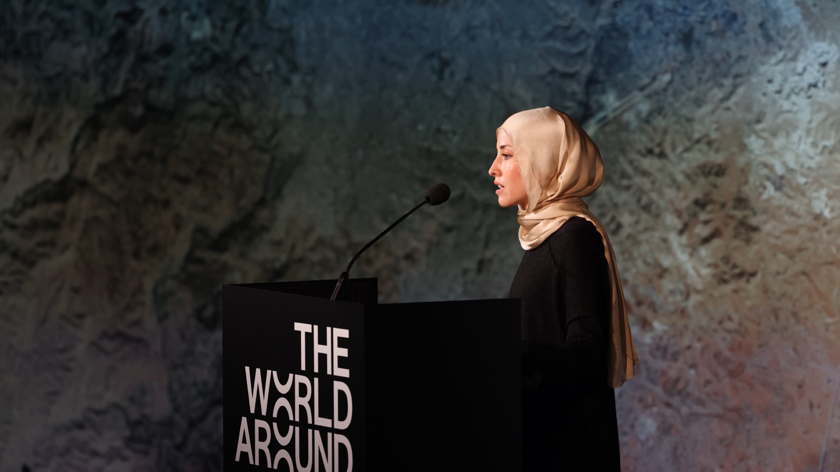 Deema Assaf speaking at The World Around Summit 2023.