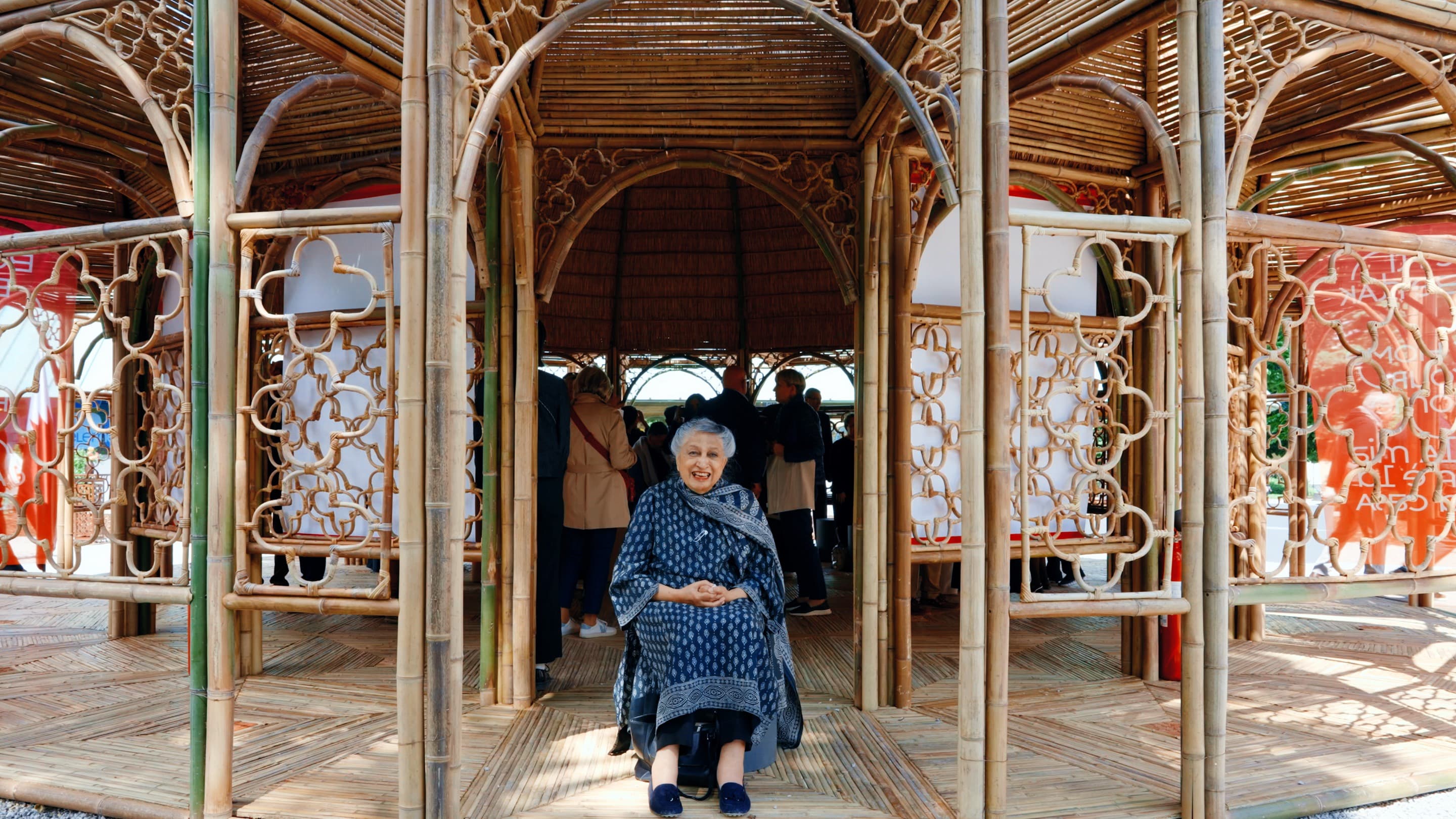 Yasmeen Lari sits in front of the Community Center at the 2025 Venice Architecture Biennale.